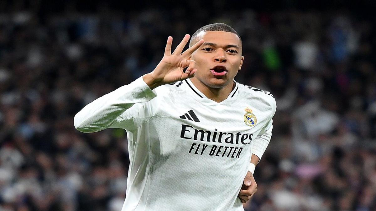 Kylian Mbappe celebrates scoring a hat-trick against Manchester City